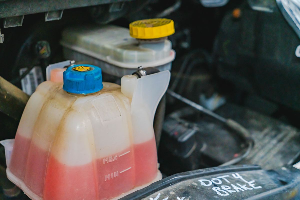 Coolant reservoir checked during a cooling system service