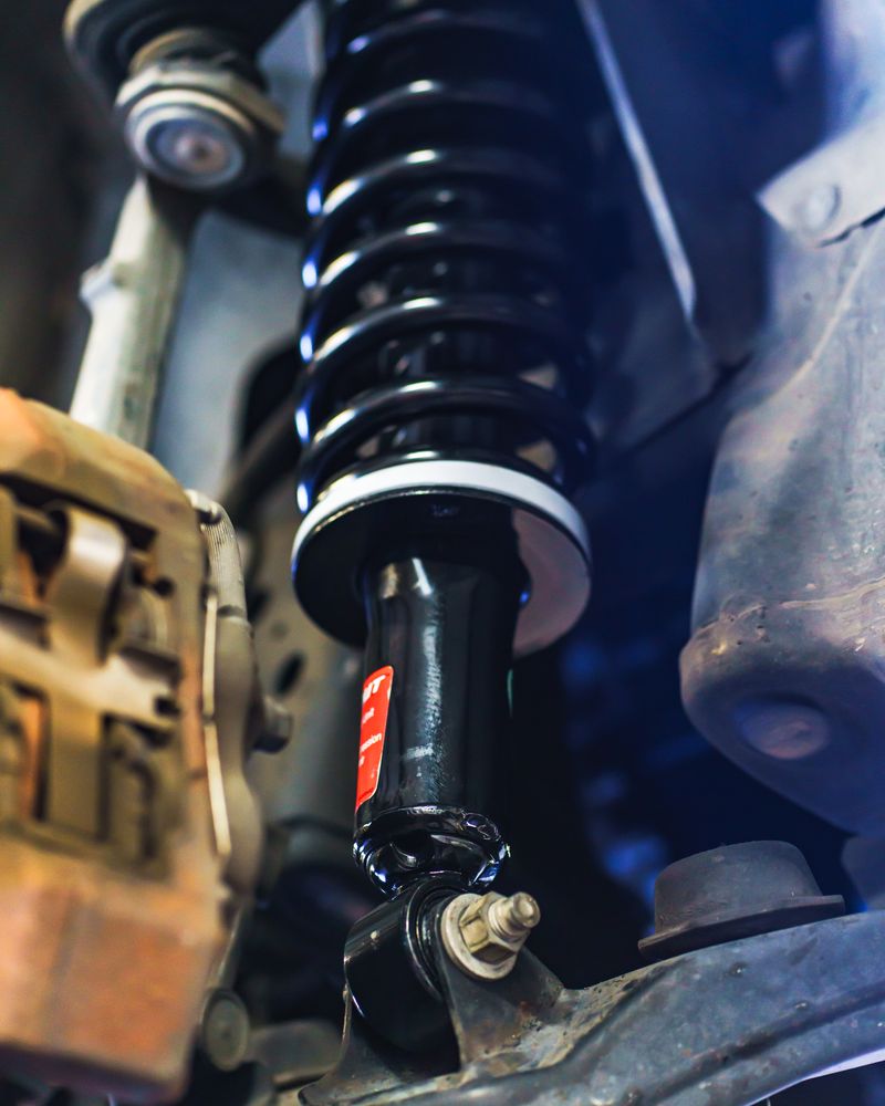 Coilover strut assembly