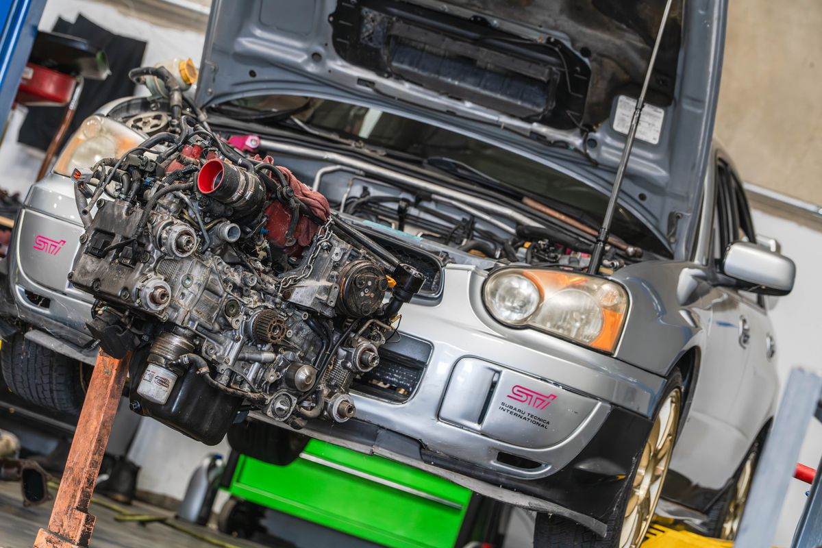 Subaru WRX with its engine removed for repair